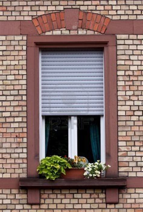 german houses with metal shutters to keep sun out|exterior shutters germany vs france.